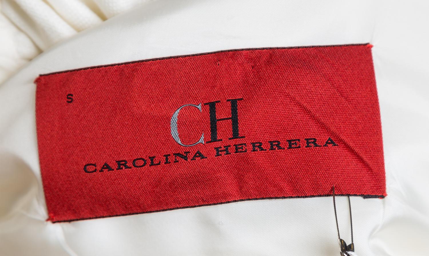 A Carolina Herrera Cream Linen Pant Suit, Jacket size small, Pant size 8.