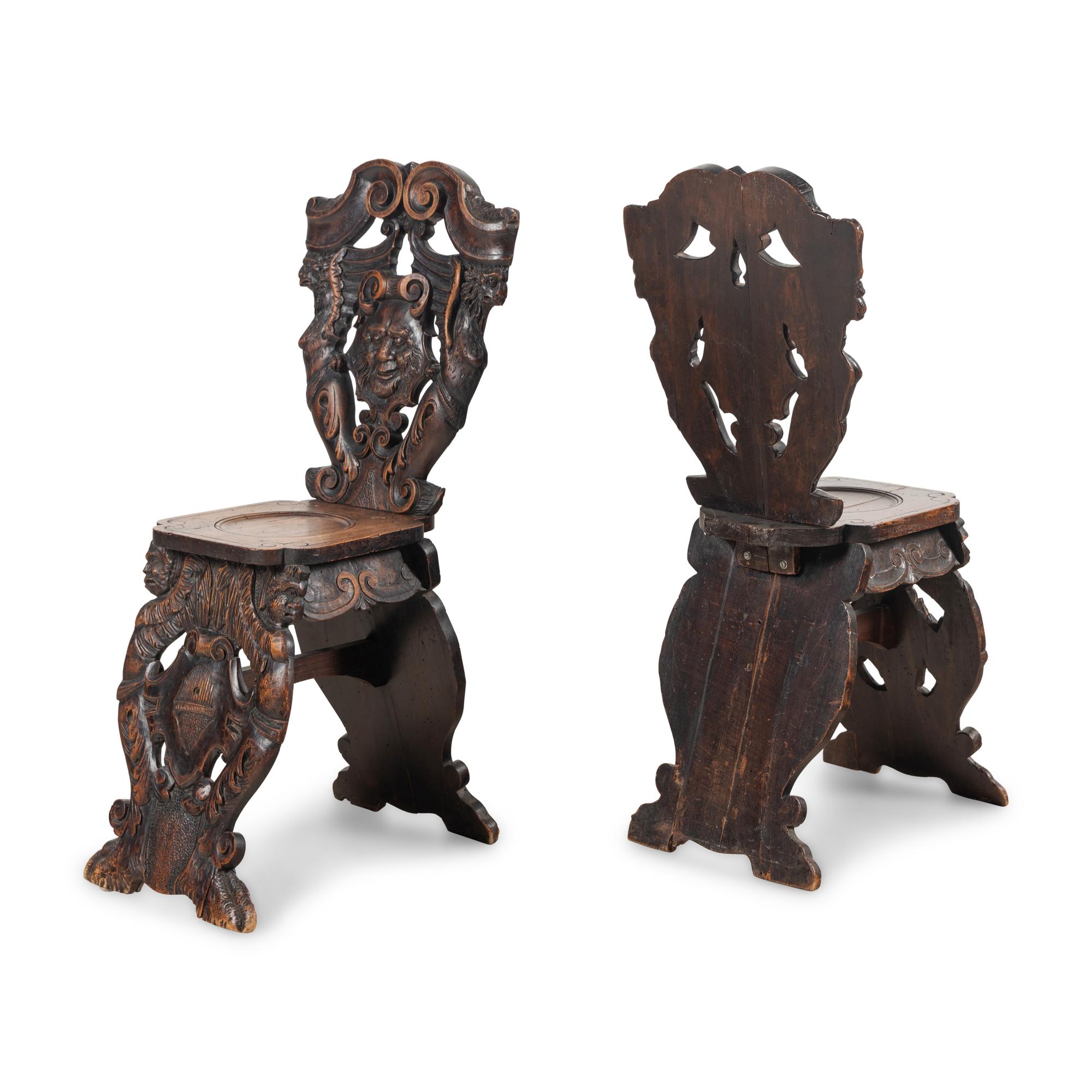 A Pair of Italian Carved Walnut Sgabello Chairs