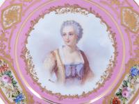 A Pair of Sèvres Painted and Parcel Gilt Pink-Ground Porcelain Plates