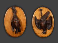 A Pair of Black Forest Style Carved Wood Game Plaques