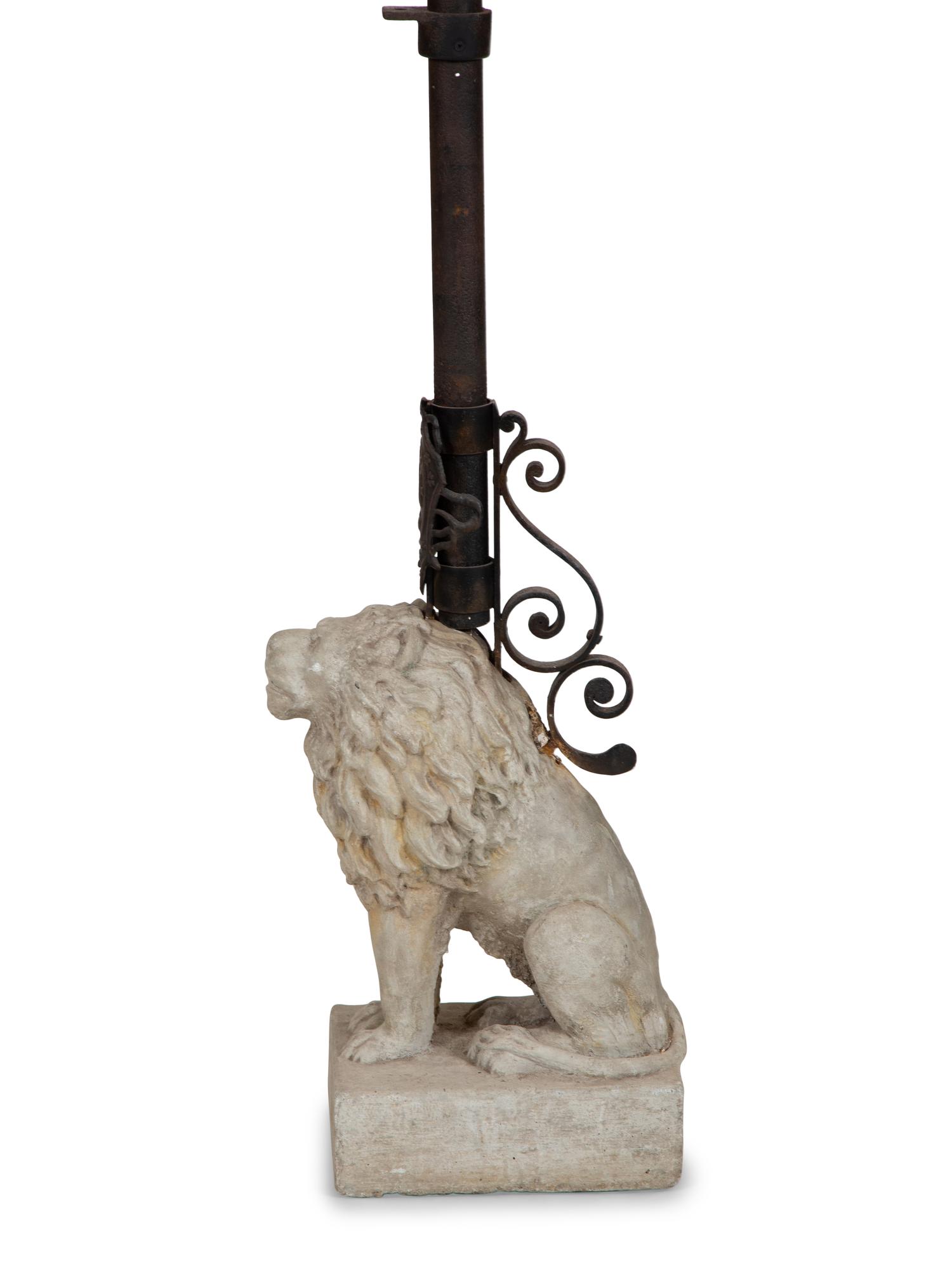 A Cast Stone Seated Lion with Iron Flag Pole in the Manner of Mizner