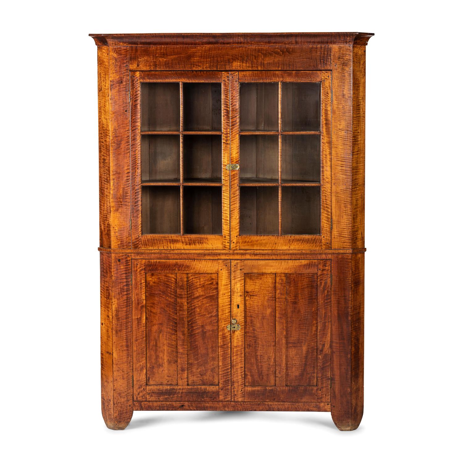 A Chippendale Tiger Maple Corner Cupboard