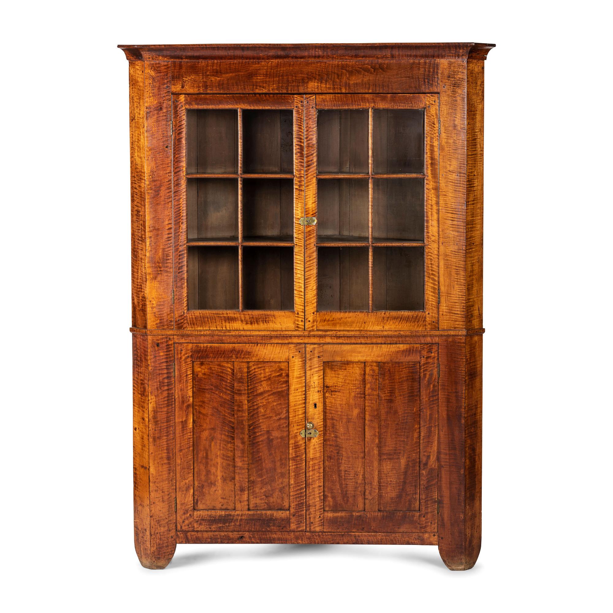 A Chippendale Tiger Maple Corner Cupboard