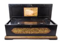 A Continental Cylinder Music Box Height of case 12 x width 37 x depth 14 inches.