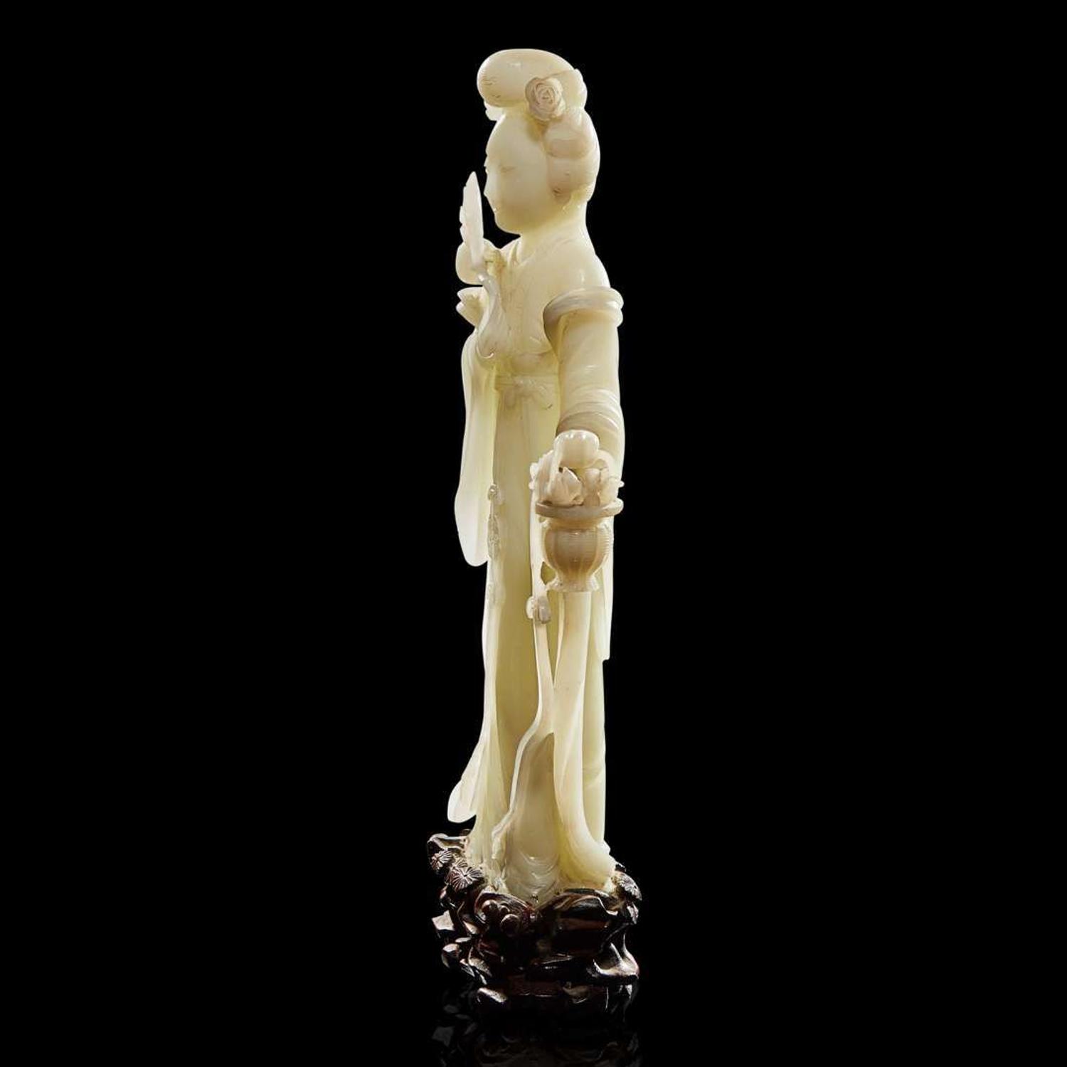 A Chinese carved white jade figure of a meiren 白玉雕美人 19th/early 20th century ????????