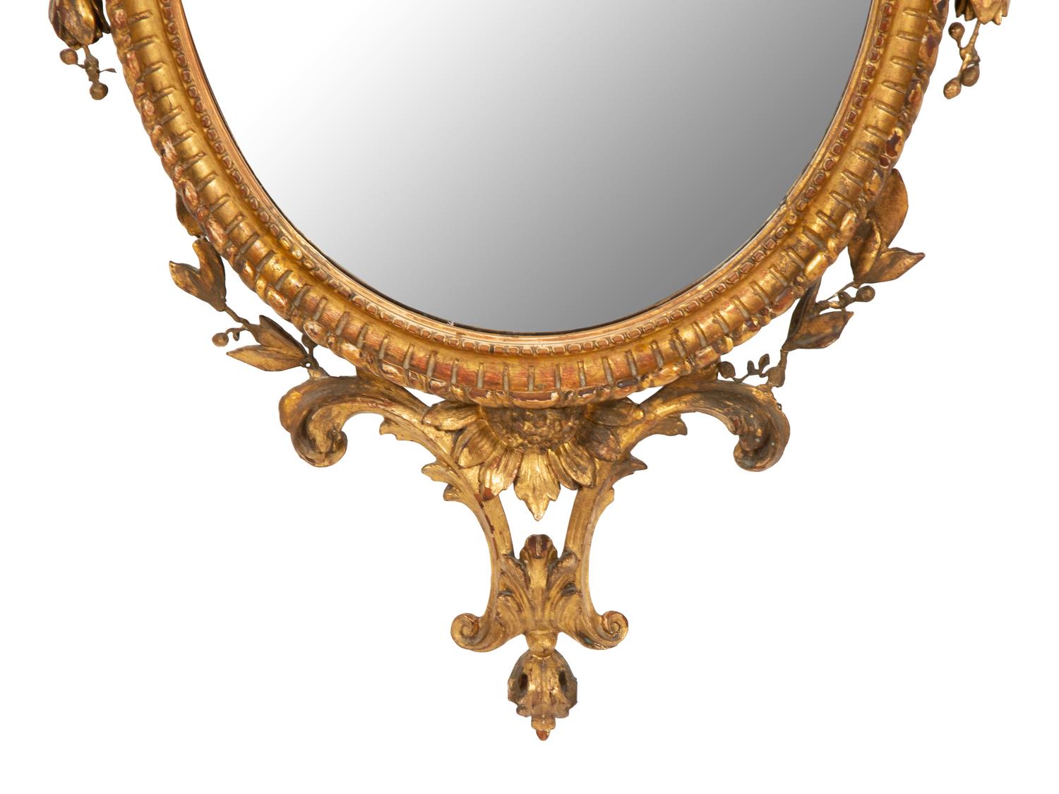 A Neoclassical Style Giltwood Oval Mirror