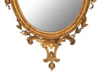 A Neoclassical Style Giltwood Oval Mirror