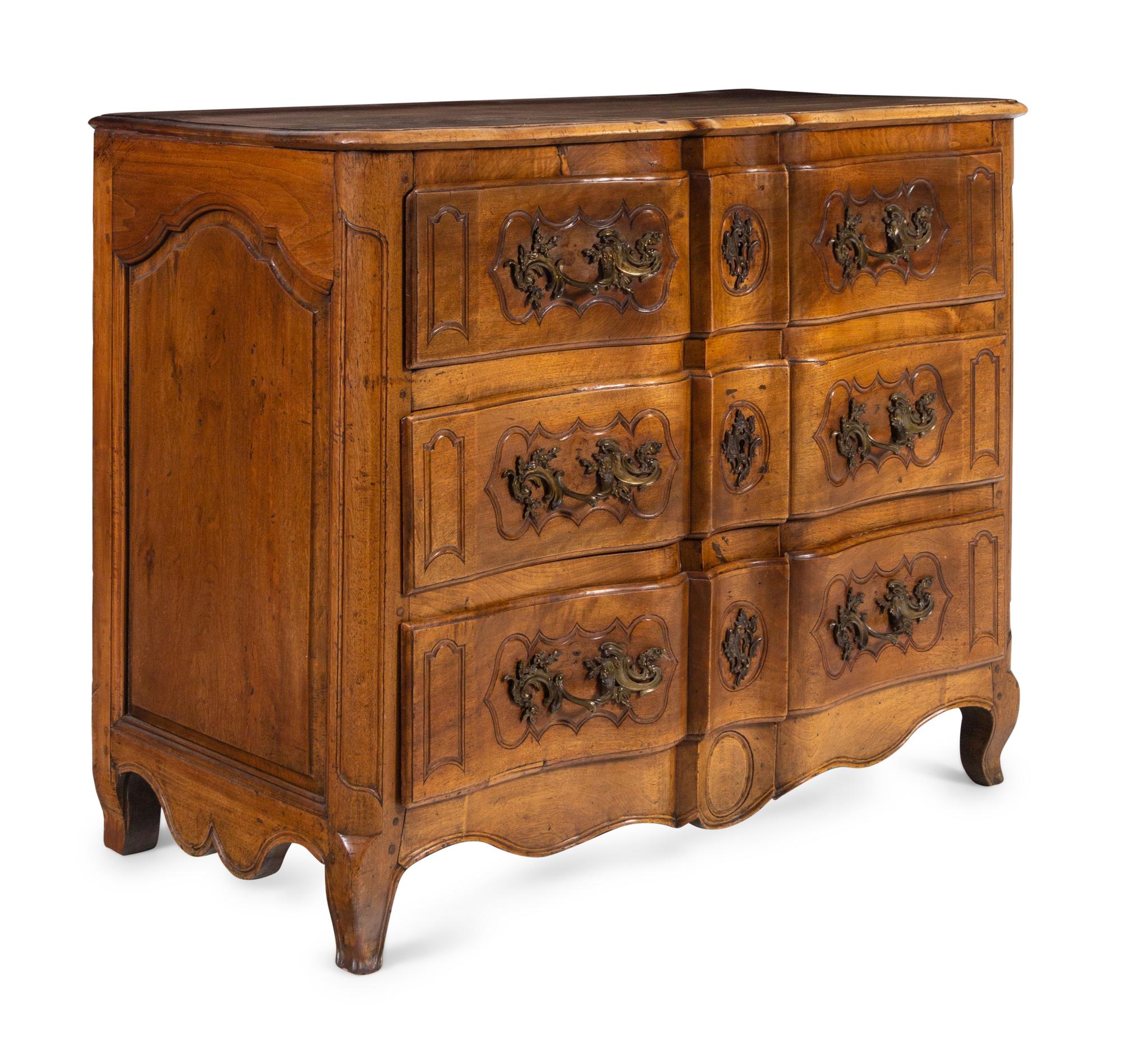 A Louis XV Provincial Walnut Serpentine-Front Commode