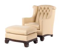 A Faux Leather Upholstered Lounge Chair and Ottoman