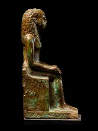 An Egyptian Faience Enthroned Queen or Goddess