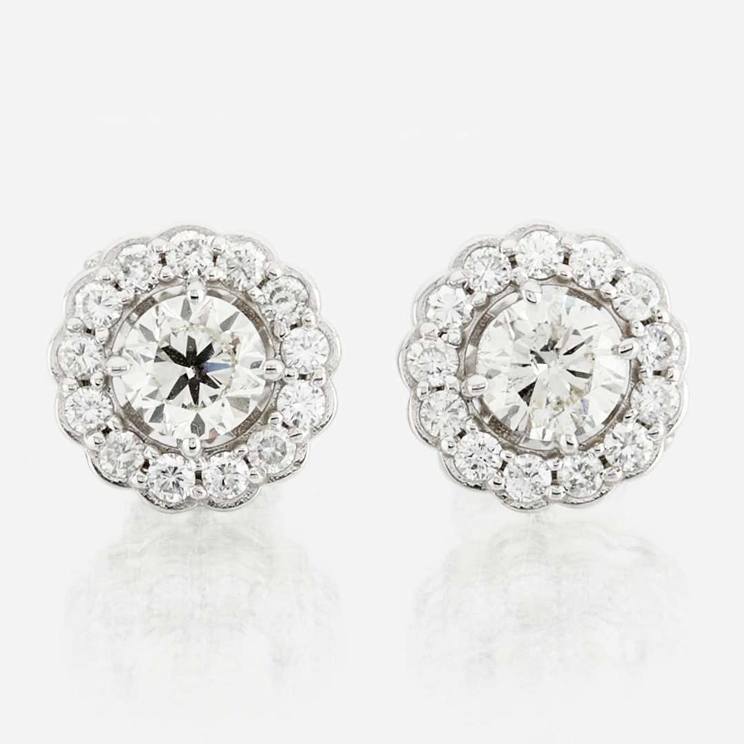A pair of diamond and white gold earrings