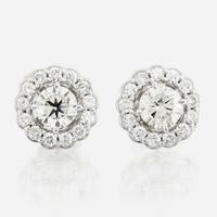 A pair of diamond and white gold earrings