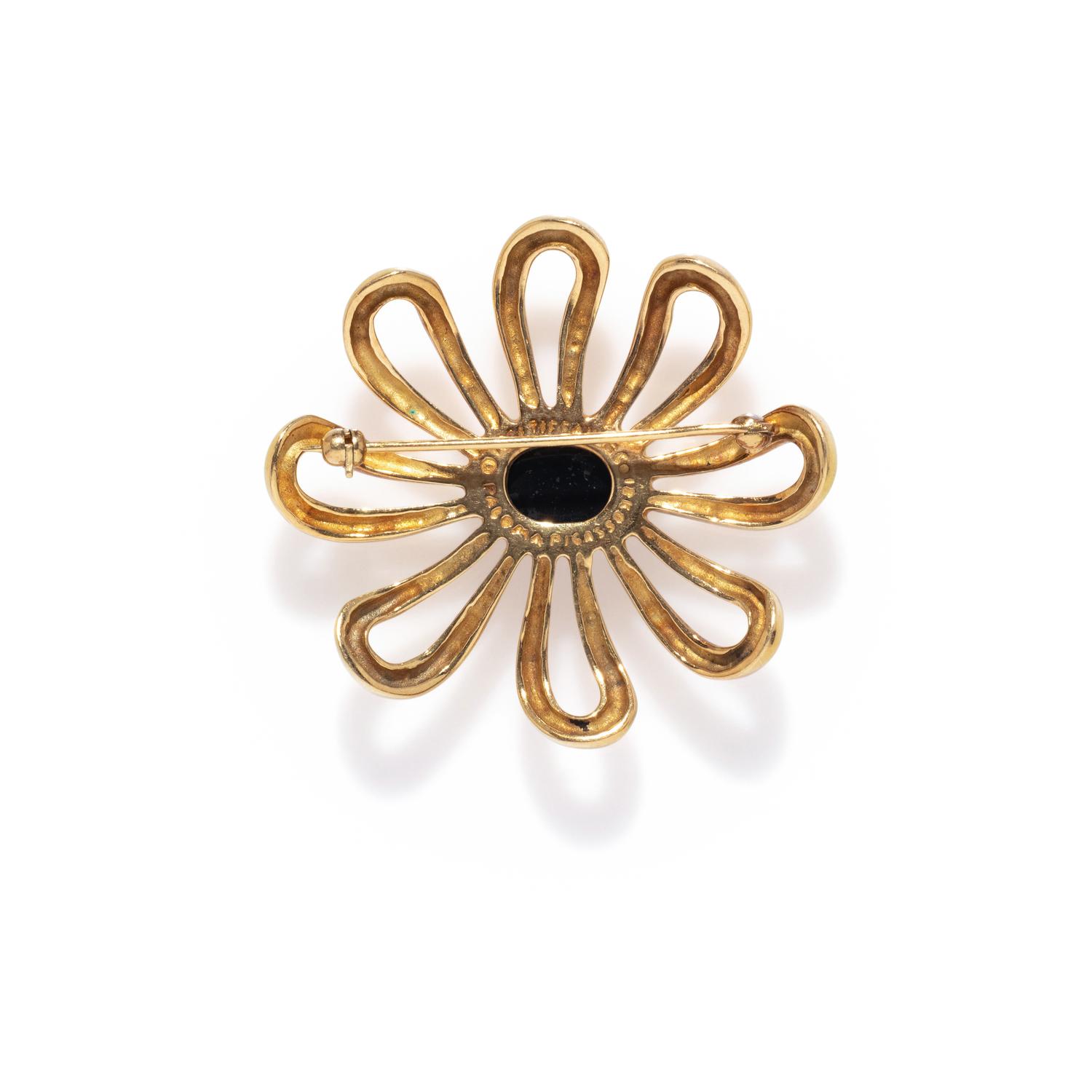 TIFFANY & CO., PALOMA PICASSO, YELLOW GOLD AND ONYX FLOWER BROOCH