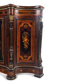 A Victorian Parcel Gilt Ebonized and Inlaid Rosewood Parlor Cabinet