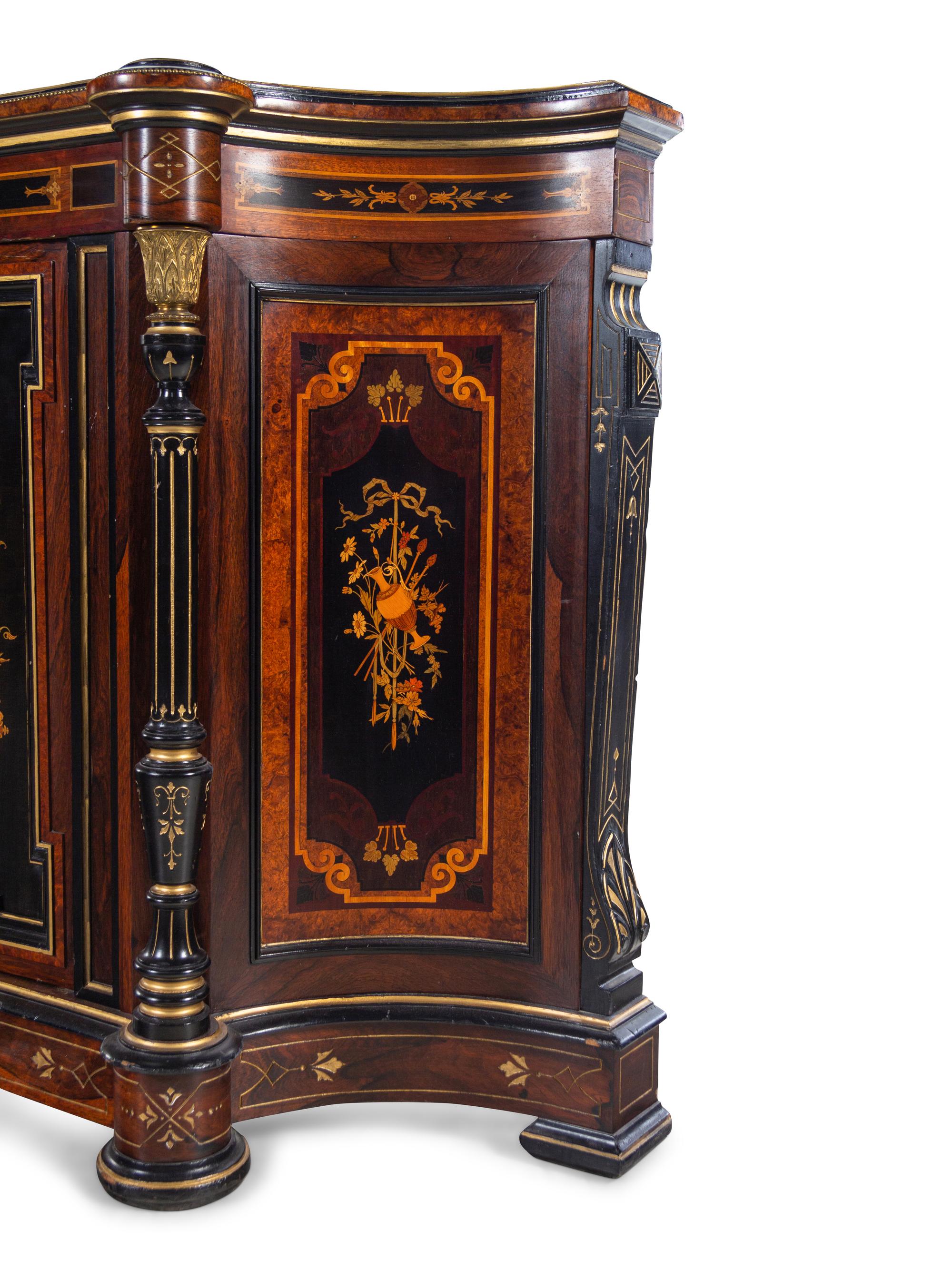 A Victorian Parcel Gilt Ebonized and Inlaid Rosewood Parlor Cabinet