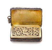 A George IV Silver Vinaigrette, Maker's mark T&WS, Birmingham, 1822, having a floral and foliate decorated border centered by a cartouc