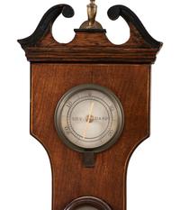 A Regency Mahogany Wheel Barometer