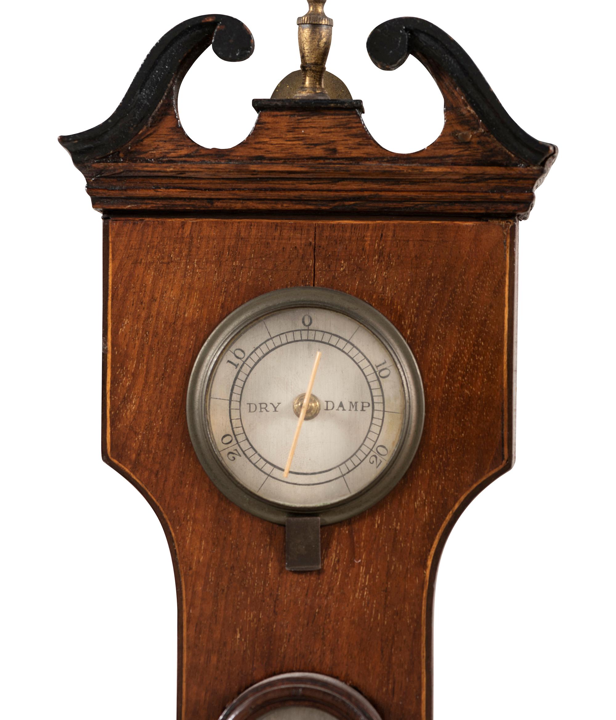 A Regency Mahogany Wheel Barometer