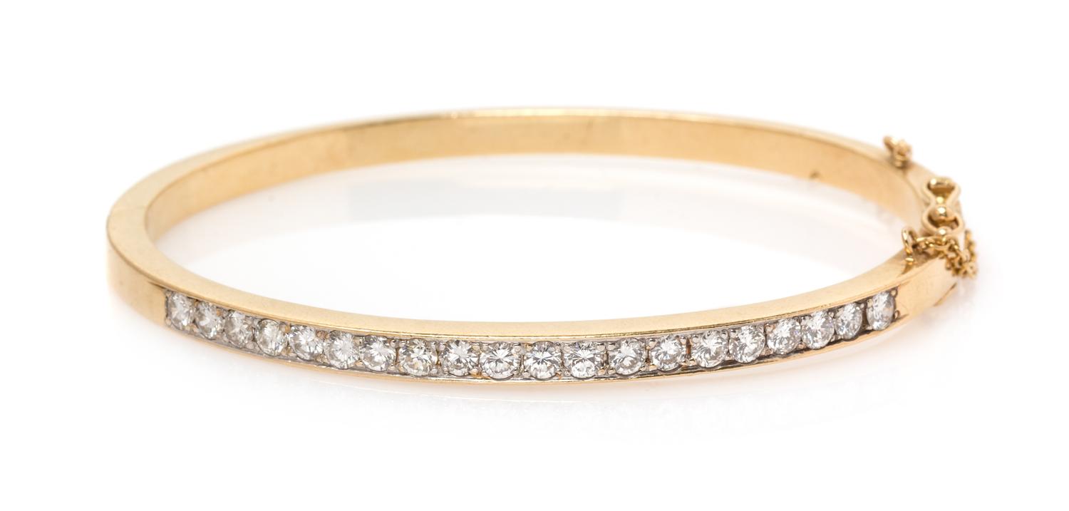 A Yellow Gold and Diamond Bangle Bracelet, 11.90 dwts.
