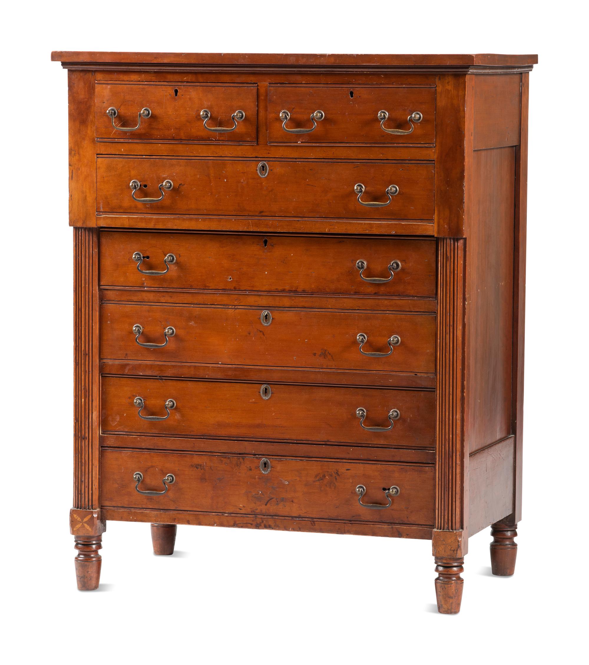 A Federal Carved and Inlaid Cherrywood Chest of Drawers