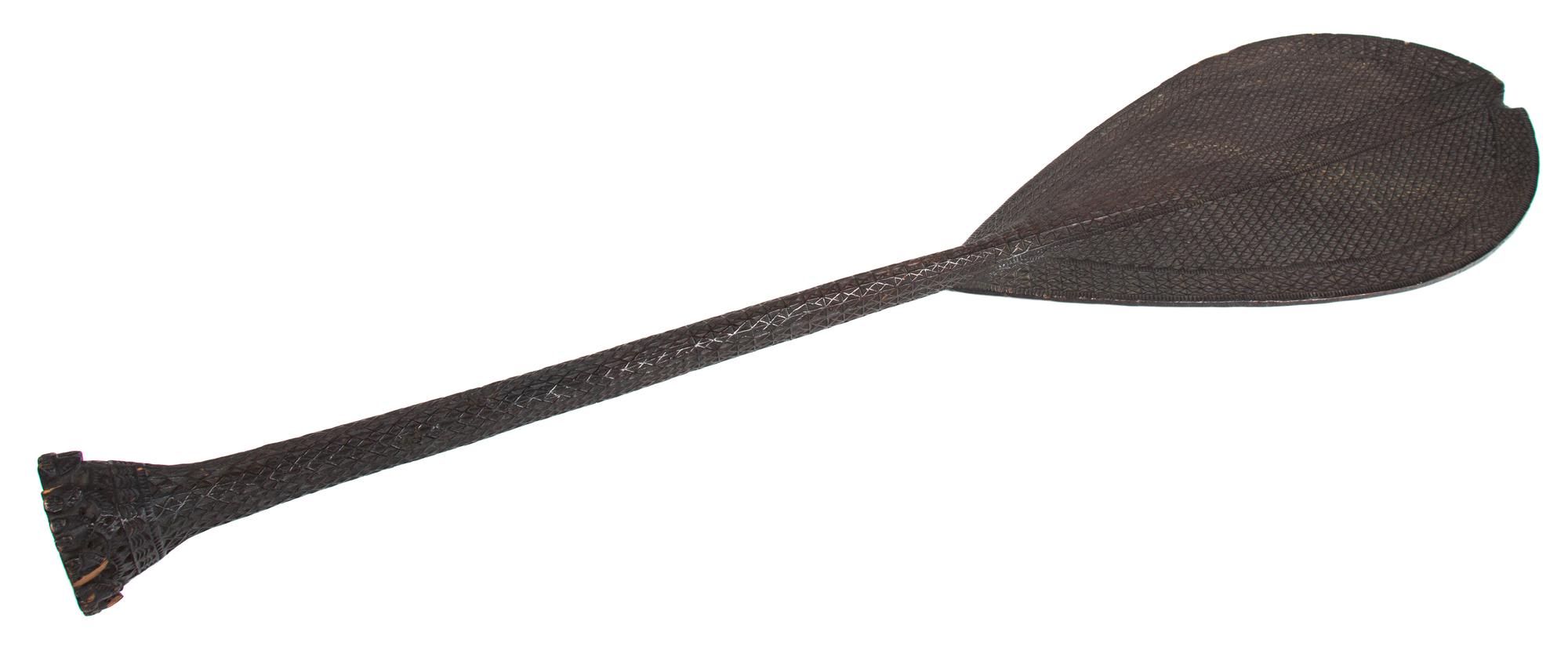 A Tribal Carved Wood Paddle Length 39 inches. — Origin Unknown