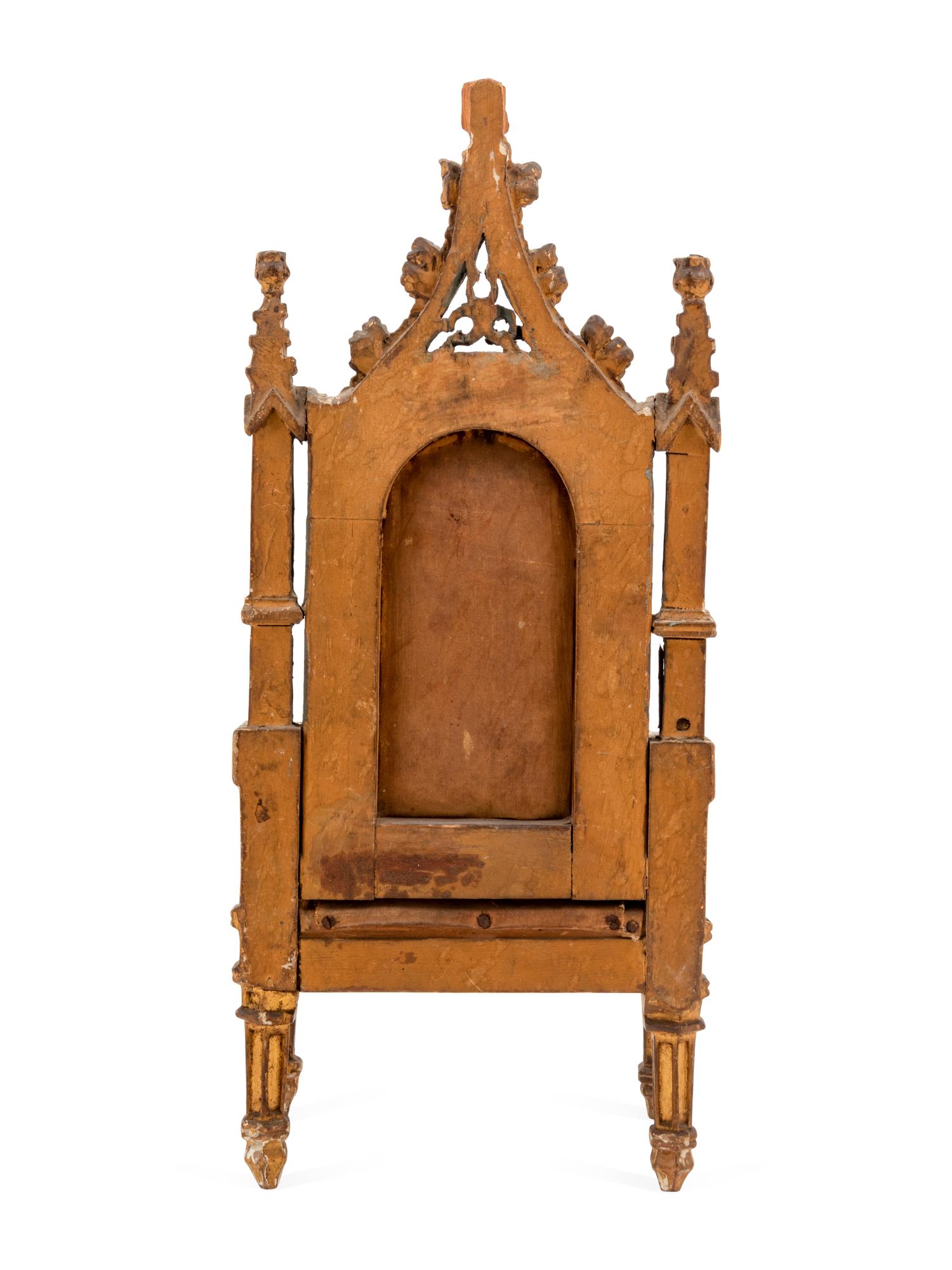 A Gothic Style Carved Giltwood Miniature Armchair