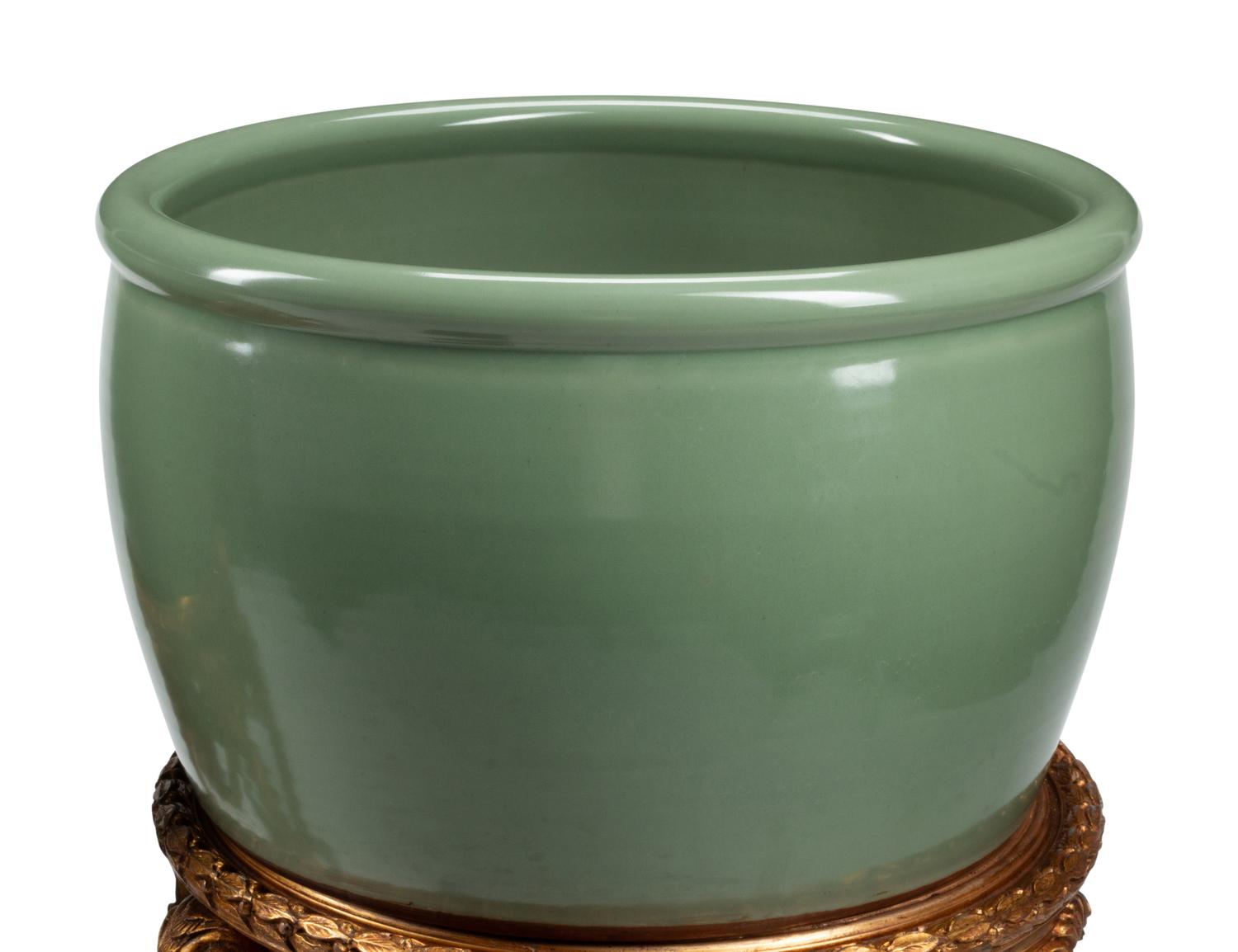 A Pair of Chinese Celadon Glazed Porcelain Fish Bowls on Giltwood Stands