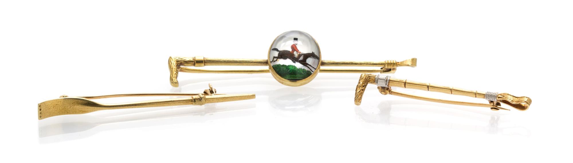 A Collection of Yellow Gold and Essex Crystal Brooches, 6.10 dwts.