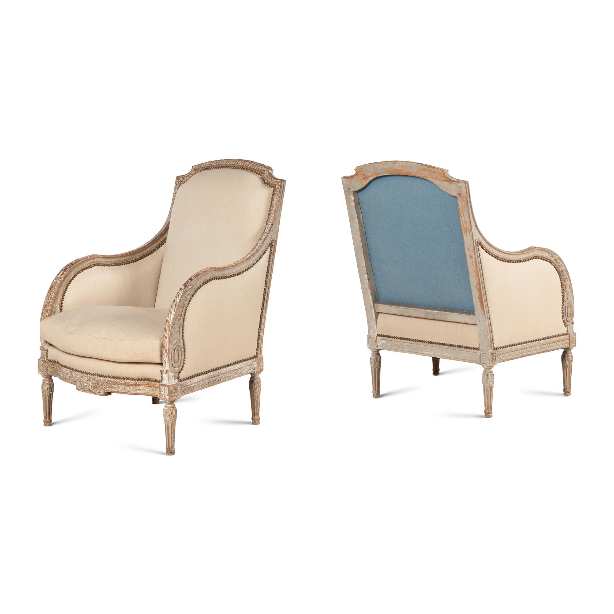 A Pair of Louis XVI Carved and Painted Bergères