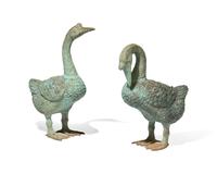 A pair of cast zinc garden statues of geese, 20th century