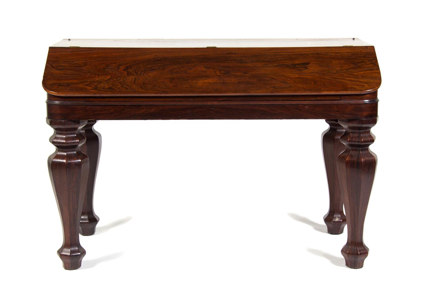 An American Rosewood Desk Height 32 3/4 x width 48 3/4 x depth 23 inches.