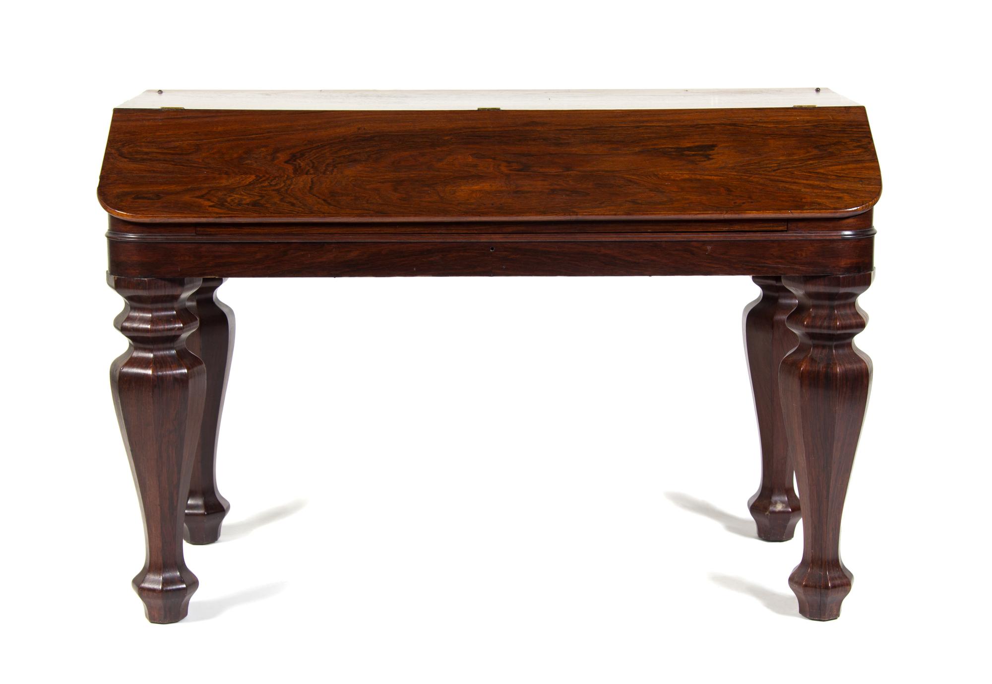 An American Rosewood Desk Height 32 3/4 x width 48 3/4 x depth 23 inches.