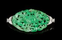 A Jadeite, White Gold and Diamond Brooch CIRCA 1920 Width 2 inches. — CIRCA 1920