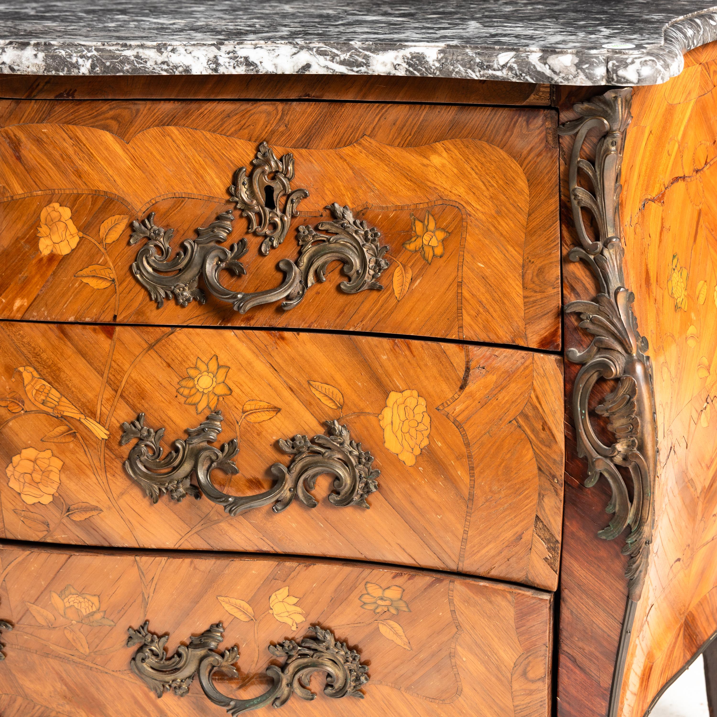 A Louis XV Gilt Bronze Mounted Marquetry, Tulipwood, and Fruitwood Marble-Top Commode