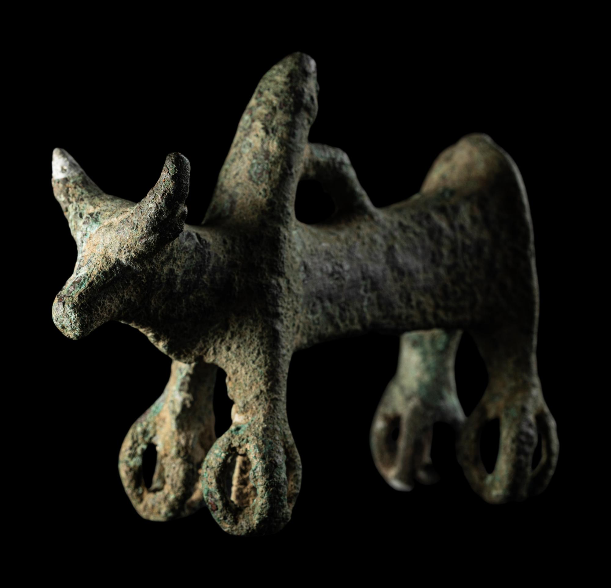 A Luristan Bronze Cow with Four Sphere Feet