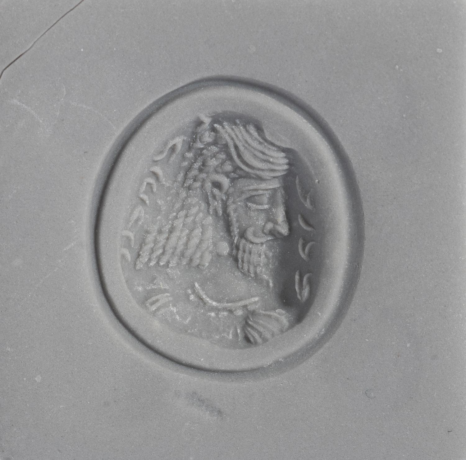A Sasanian Amethyst Ring Stone with a Royal Portrait and Pahlavi Inscription — Set in a gold ring