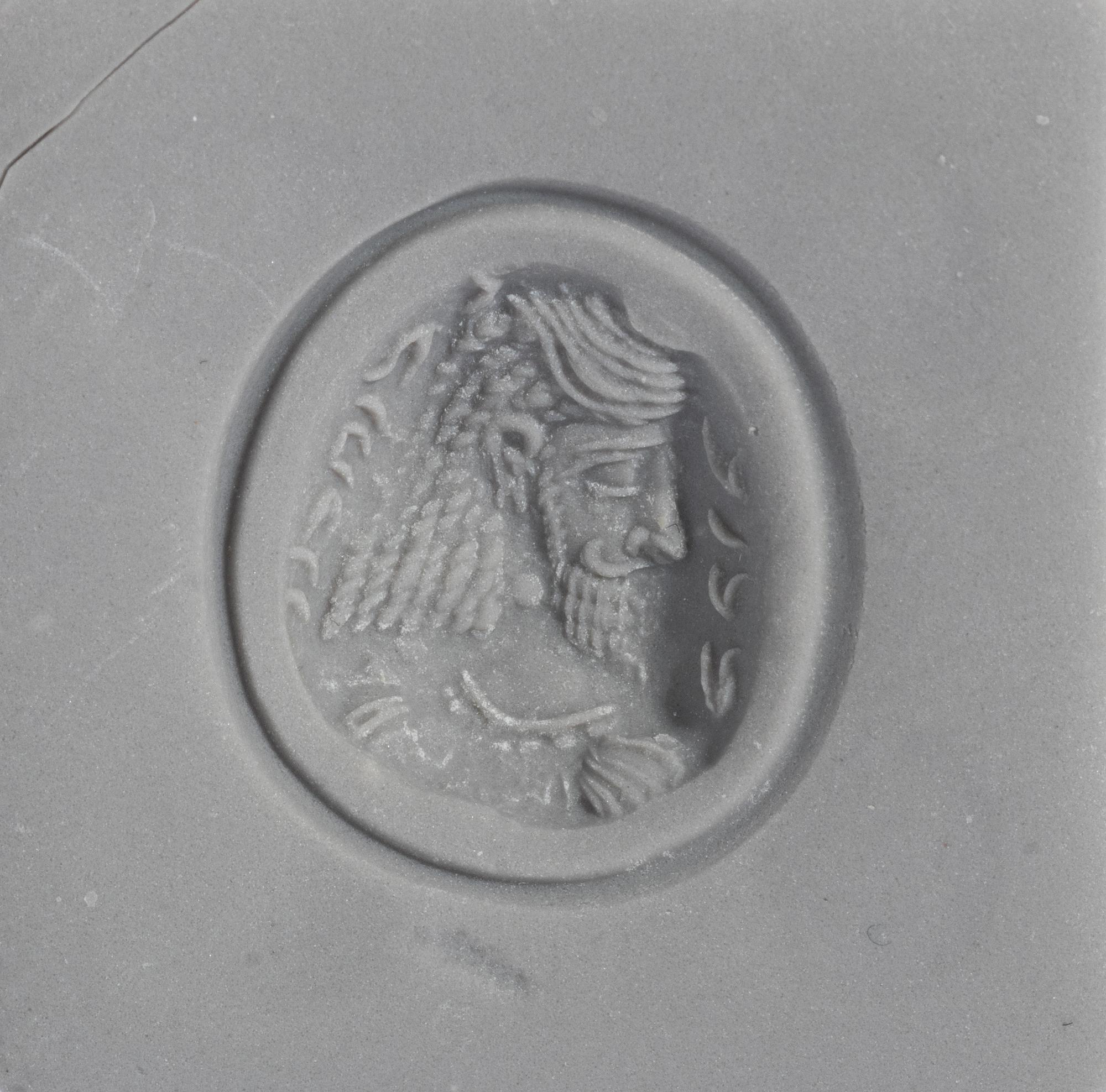 A Sasanian Amethyst Ring Stone with a Royal Portrait and Pahlavi Inscription — Set in a gold ring