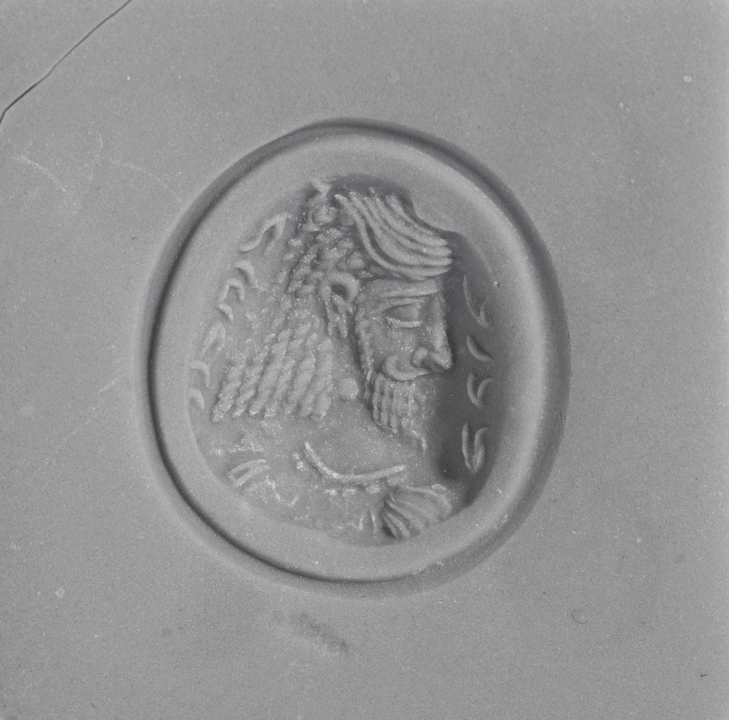 A Sasanian Amethyst Ring Stone with a Royal Portrait and Pahlavi Inscription — Set in a gold ring