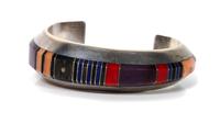 A Navajo Silver and Multi Stone Inlay Cuff, Gibson Nez Length 5 x opening 1 1/4 x width 7/8 inches.