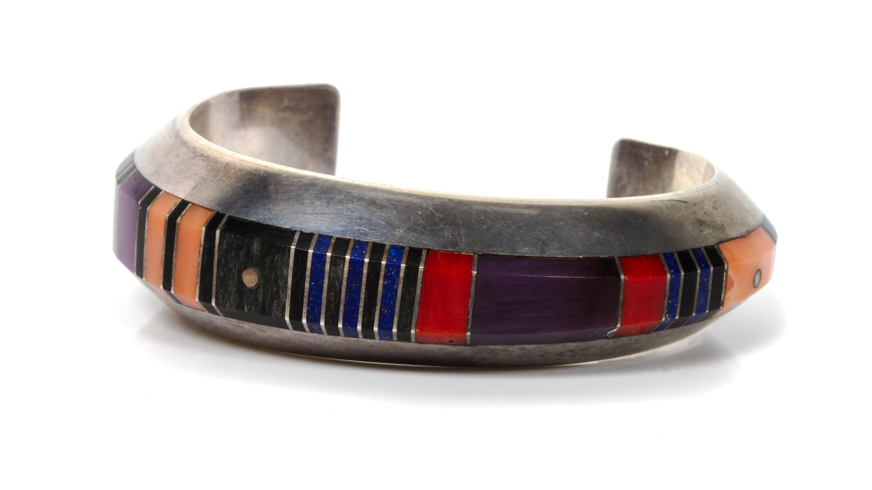 A Navajo Silver and Multi Stone Inlay Cuff, Gibson Nez Length 5 x opening 1 1/4 x width 7/8 inches.