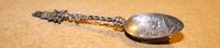 A Dutch Silver Souvenir Spoon, makers mark obscured, 1903, having a twist stem with a windmill finial, the bowl decorated with a villag