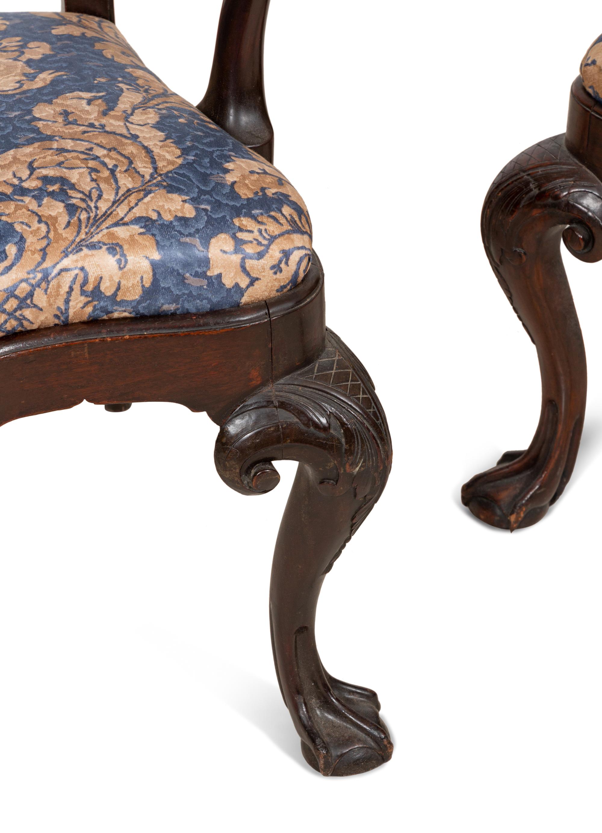 A Set of Twelve Continental Walnut Dining Chairs