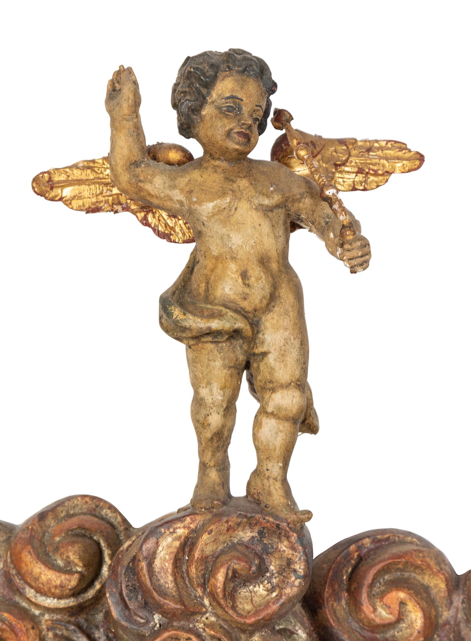 A Florentine Carved Giltwood and Silvered Wood Altarpiece with Musical Putti