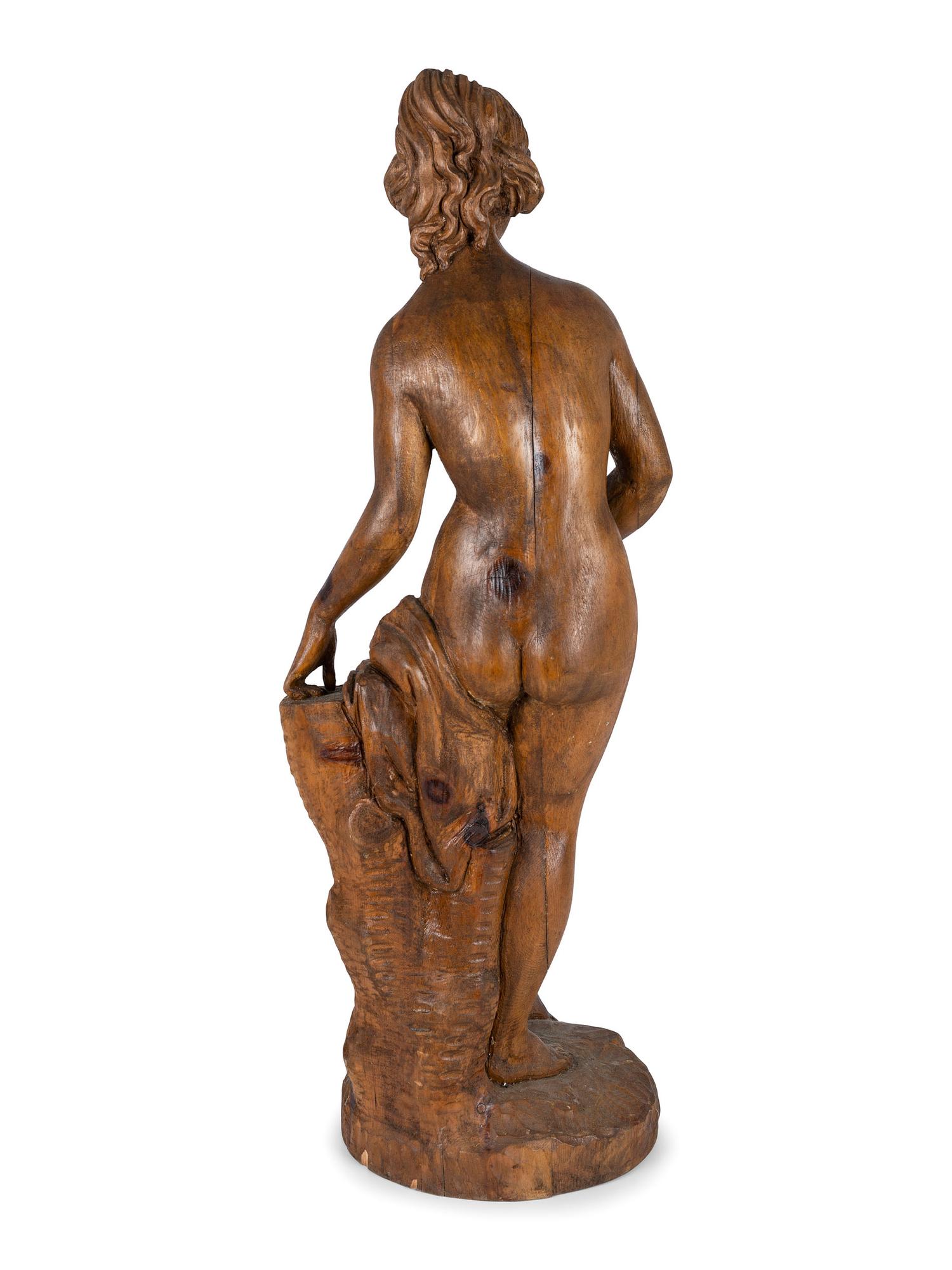 A Classically Inspired Carved Wooden Sculpture of a Standing Nude Female