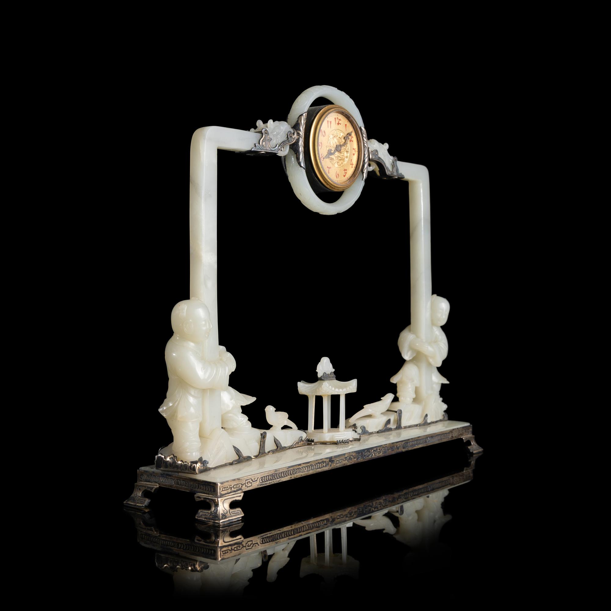 An Edward I. Farmer White Jade and Silver Mounted Chinoiserie Desk Clock, Circa 1930 Edward I. Farmer約1930年製中國風白玉童子座鐘