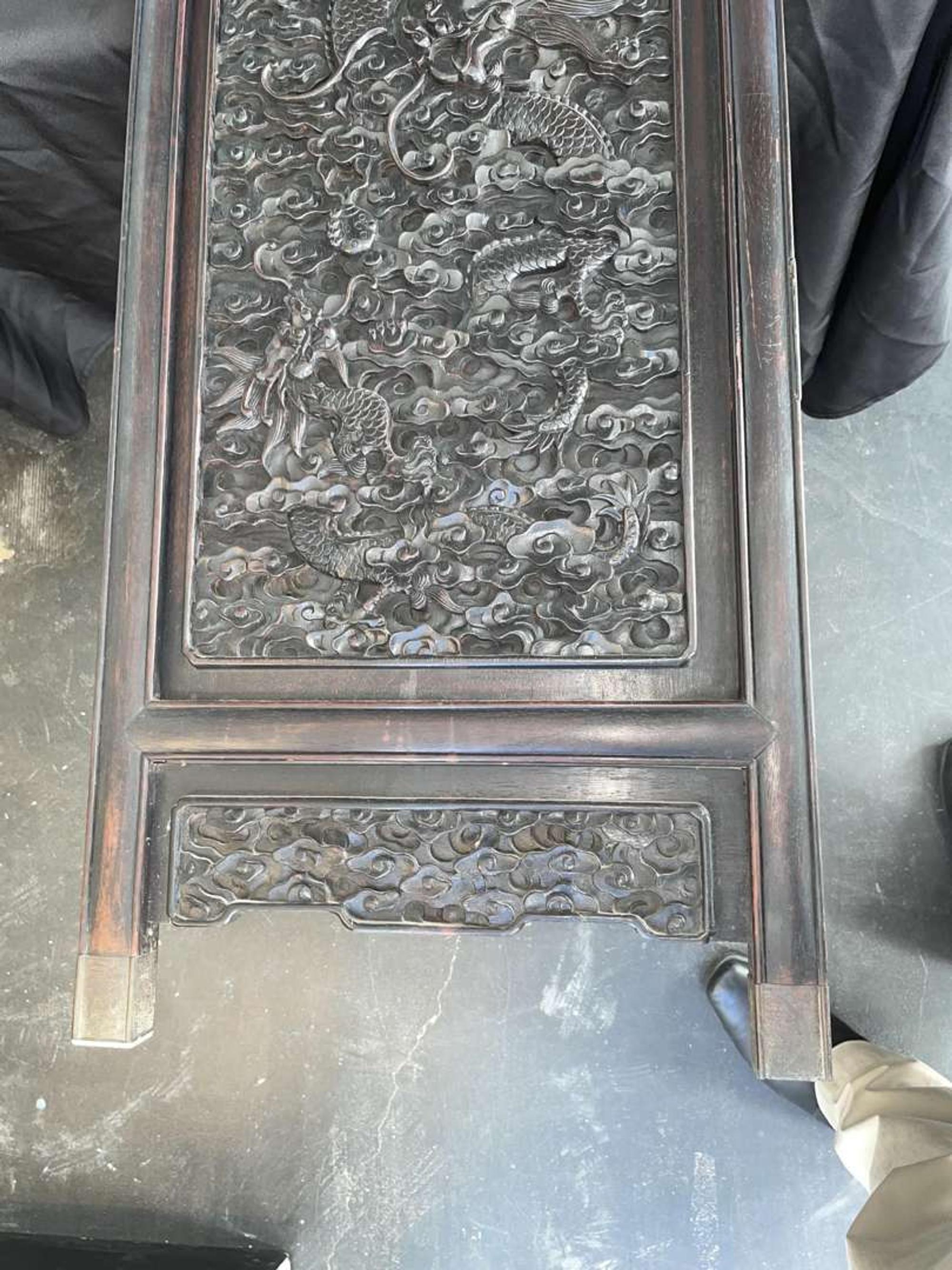 A Chinese carved hardwood six-panel “Dragons” screen 硬木浮雕龙纹六开屏风