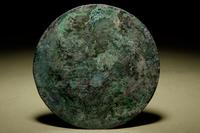 A Bronze Circular 'Phoenix’ Mirror