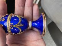 A 14 Karat Vari-Color Gold, Guilloché Enamel, Diamond, and Cabochon Jewel-Mounted Egg-Form Perfume and a Related Guilloché Enamel, 14 Karat Vari-Color Gold, Diamond, and Cabochon-Mounted Surprise Egg