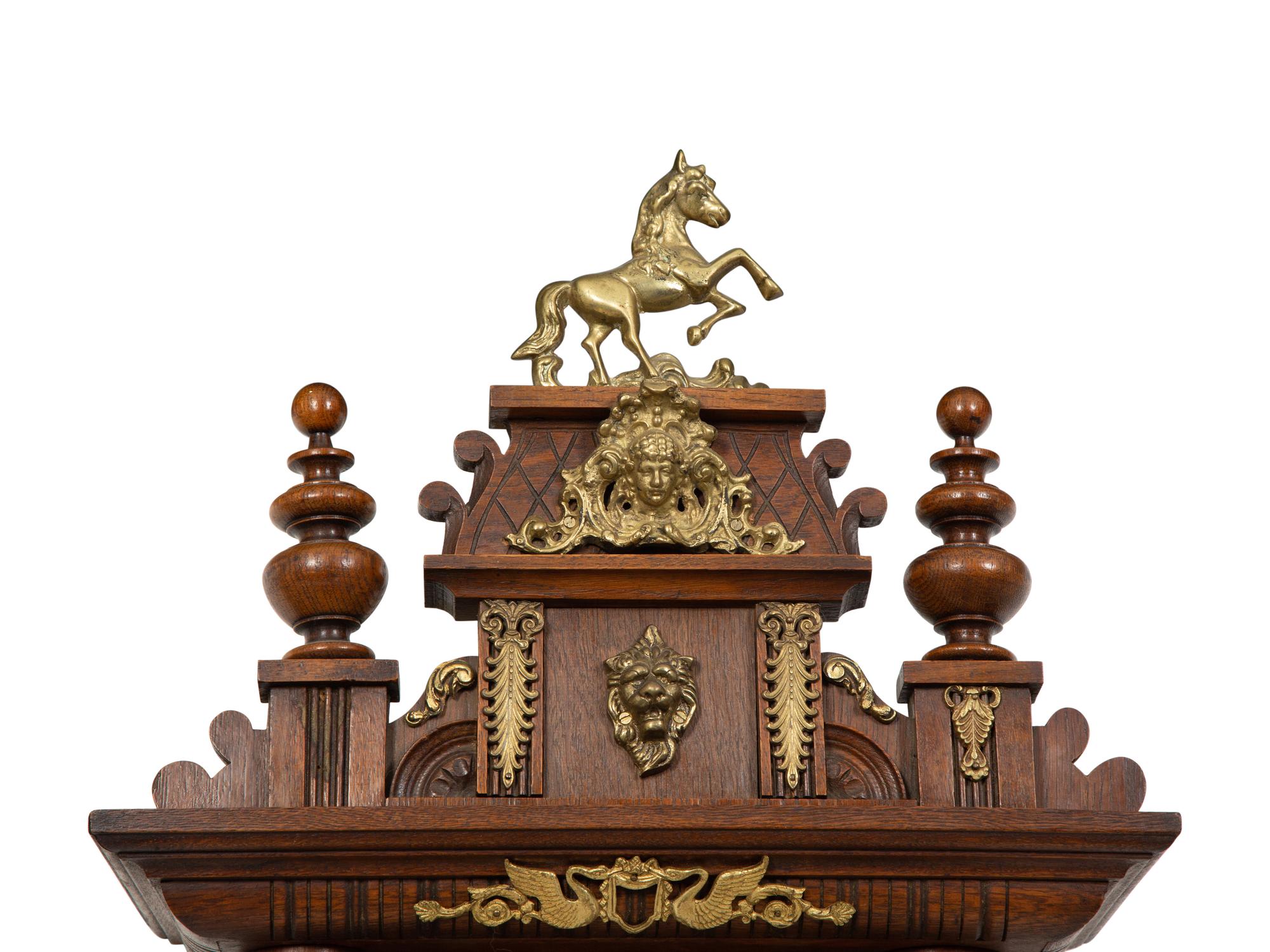 An Austrian Carved Oak Regulator Clock