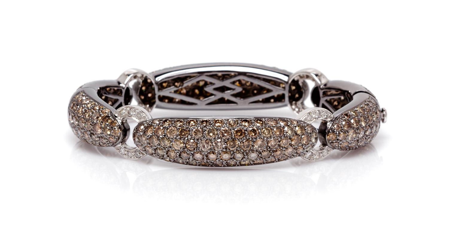 An 18 Karat White Gold, Colored Diamond and Diamond Bracelet, 30.10 dwts.